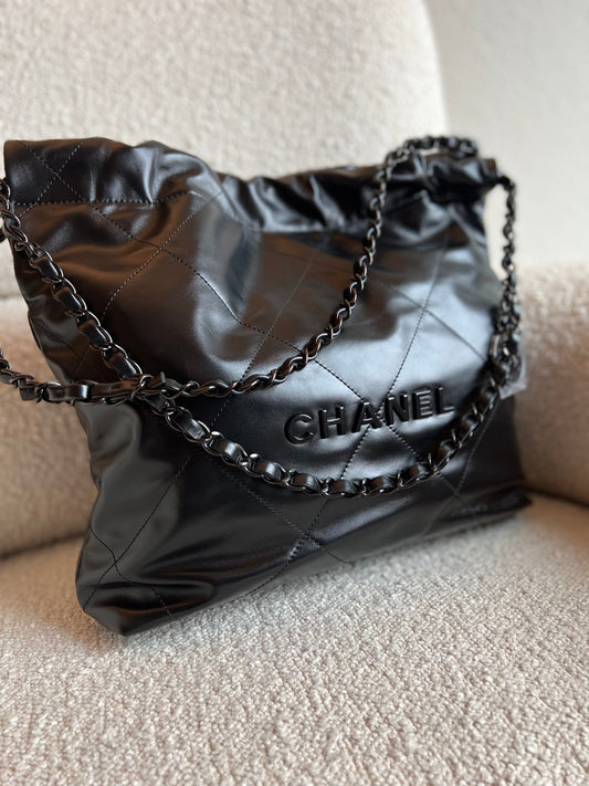 So Black Calfskin Quilted Drawstring 22 Bag small Black Hardware